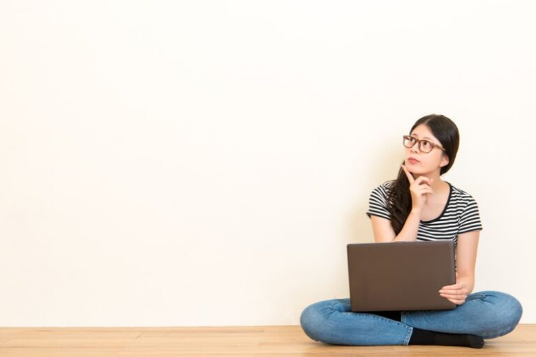 A woman is sitting on the floor